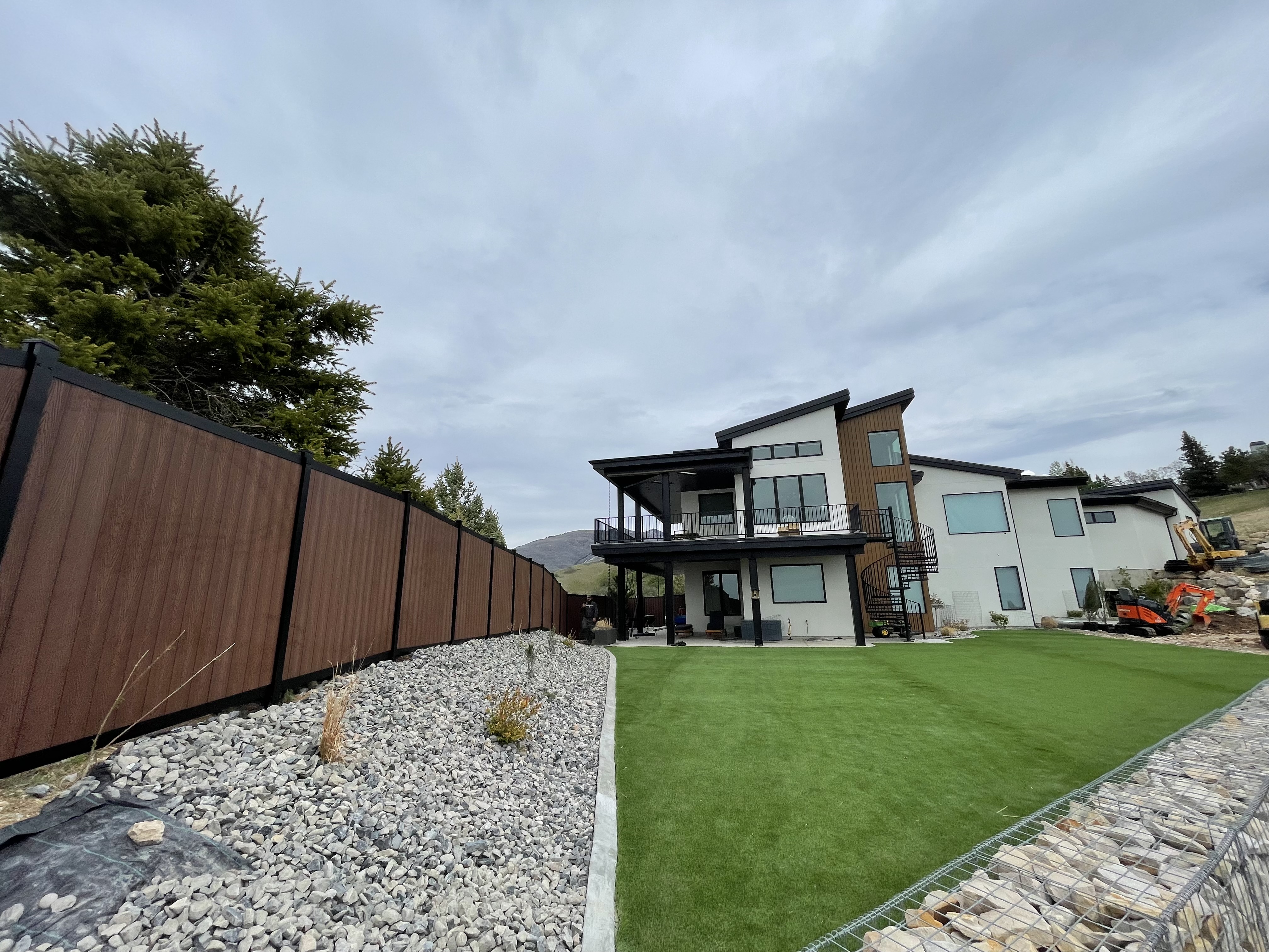 Black Avimore Aluminum with Composite Brown Wood Grain Fill installed by Spacemakers Fence in Bountiful, Utah